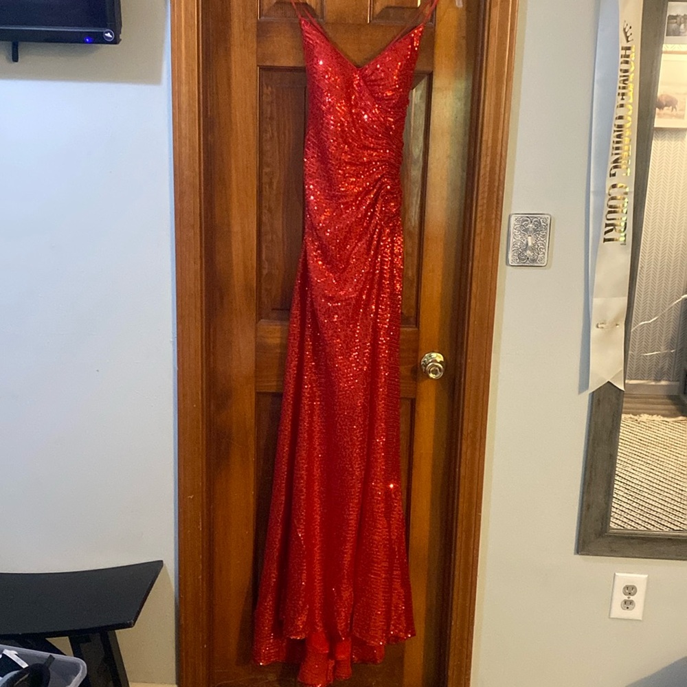 Red sequin prom dress with side split